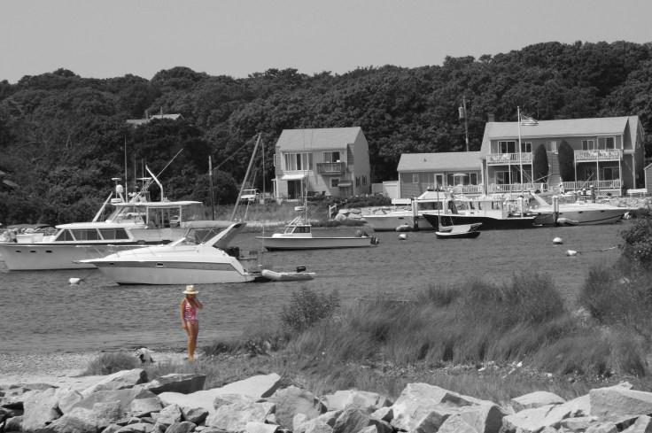 Summer 2009 - Martha's Vineyard woman on cell phone in swimsuit and hat cropped and b&w